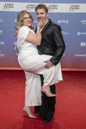 ABB FIRSTSTEPS: Gisa Flake and Knud Riepen walk the red carpet at the 2026 FIRST STEPS Awards ceremony at the Theater des Westens on October 5, 2026, in Berlin, Germany