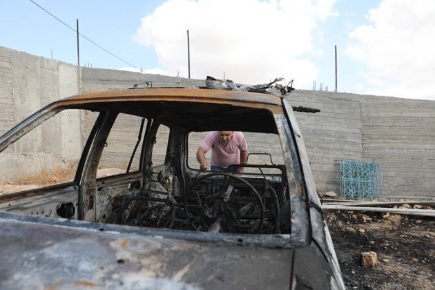 Palestinian Inspects Burned Vehicles Near al-Samu South of Hebron A Palestinian man inspects his burned vehicles near the town of al-Samu, south of Hebron, in the West Bank, on October 6, 2026, after an apparent arson attack believed to have been carried out by Israeli settlers. The incident comes amid an increase in settler attacks on Palestinians and their property in different areas of the West Bank. Photo by Mamoun Wazwaz apaimages Hebron West Bank Palestinian Territory 061026_Hebron_MW_00(6) Copyright: xapaimagesxMamounxWazwazx xapaimagesx