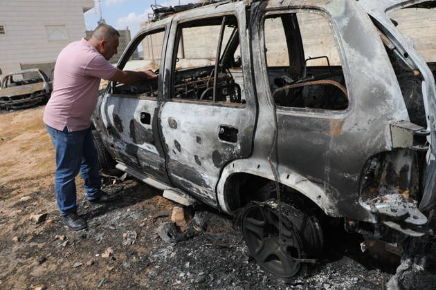 Palestinian Inspects Burned Vehicles Near al-Samu South of Hebron A Palestinian man inspects his burned vehicles near the town of al-Samu, south of Hebron, in the West Bank, on October 6, 2026, after an apparent arson attack believed to have been carried out by Israeli settlers. The incident comes amid an increase in settler attacks on Palestinians and their property in different areas of the West Bank. Photo by Mamoun Wazwaz apaimages Hebron West Bank Palestinian Territory 061026_Hebron_MW_00(12) Copyright: xapaimagesxMamounxWazwazx xapaimagesx