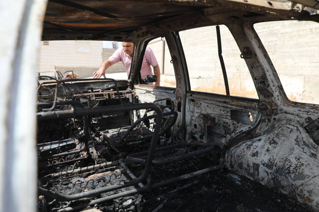 Palestinian Inspects Burned Vehicles Near al-Samu South of Hebron A Palestinian man inspects his burned vehicles near the town of al-Samu, south of Hebron, in the West Bank, on October 6, 2026, after an apparent arson attack believed to have been carried out by Israeli settlers. The incident comes amid an increase in settler attacks on Palestinians and their property in different areas of the West Bank. Photo by Mamoun Wazwaz apaimages Hebron West Bank Palestinian Territory 061026_Hebron_MW_00(10) Copyright: xapaimagesxMamounxWazwazx xapaimagesx