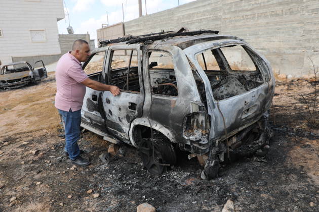 Palestinian Inspects Burned Vehicles Near al-Samu South of Hebron A Palestinian man inspects his burned vehicles near the town of al-Samu, south of Hebron, in the West Bank, on October 6, 2026, after an apparent arson attack believed to have been carried out by Israeli settlers. The incident comes amid an increase in settler attacks on Palestinians and their property in different areas of the West Bank. Photo by Mamoun Wazwaz apaimages Hebron West Bank Palestinian Territory 061026_Hebron_MW_00(14) Copyright: xapaimagesxMamounxWazwazx xapaimagesx