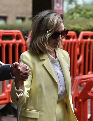 Russell Brand and his wife leave court in London LONDON, UNITED KINGDOM - OCTOBER 6: British comedian Russell Brand (not seen) leaves Southwark Crown Court with his wife, Laura Brand, following a preliminary hearing related to rape and sexual assault allegations against him in London, United Kingdom, on October 6, 2026. Rasid Necati Aslim Anadolu London United Kingdom. Editorial use only. Please get in touch for any other usage.  Copyright: x2026xAnadoluxRasidxNecatixAslimx