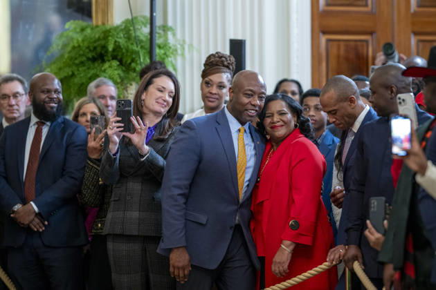 October 6, 2026, Washington, Dc, United States: U.S Senator Tim Scott, R-SC, center, embraces criminal rights advocate Alice Johnson, right, as Secretary of Agriculture Brooke Rollins, left, looks on during a Black History Month event at the East Room of the White House, February 20, 2025 in Washington, D.C. Washington United States - ZUMAp138 20261006_zaa_p138_005 Copyright: xMollyxRiley WhitexHousex
