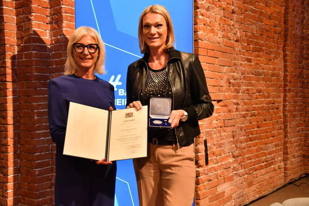 Ulrike Scharf, Bavarian Minister of State, and Maria Höfl Riesch: Award Ceremony for the Bavarian State Medal for Social Service 2026, All Saints Day, Hofkirche, Munich, October 6, 2026