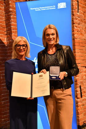 Ulrike Scharf, Bavarian Minister of State, and Maria Höfl Riesch: Award Ceremony for the Bavarian State Medal for Social Service 2026, All Saints Day, Hofkirche, Munich, October 6, 2026