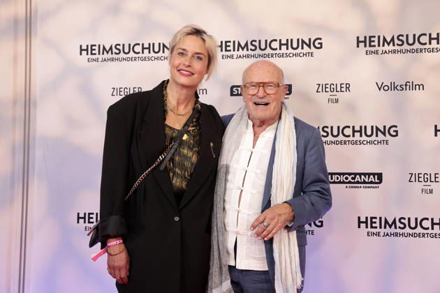Susanne Wolff and Volker Schloendorff attend the premiere of *Heimsuchung: The Beloved* at Kino International on October 6, 2026, in Berlin, Germany. *Heimsuchung: The Beloved* premiere in Berlin, Germany