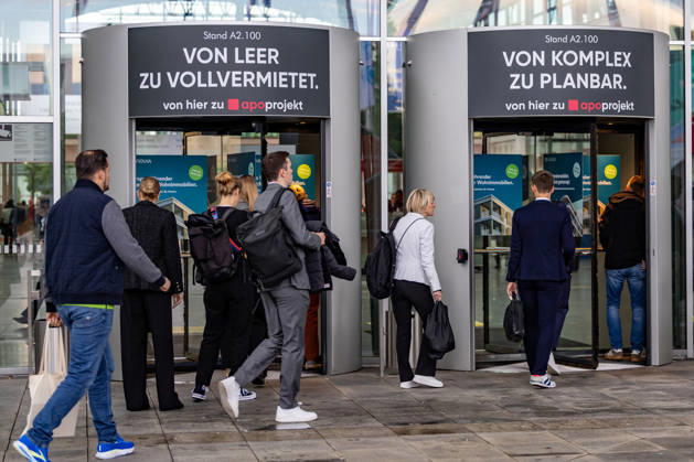 EXPO REAL 2026 in Munich, October 5, 2026: Trade visitors on their way to the exhibition halls at the Messe München grounds. First day of EXPO REAL 2026, the international trade fair for real estate, investments, and infrastructure will take place in Munich from October 5 to 7, 2026, bringing to