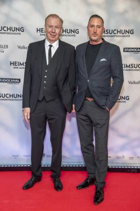 ABB HEIMSUCHUNG: Ludger Pistor and Jan Christoph Wagner appear on the red carpet at the German premiere of Volker Schloendorff’s film *Heimsuchung* at the Kino International on October 6, 2026, in Berlin, Germany