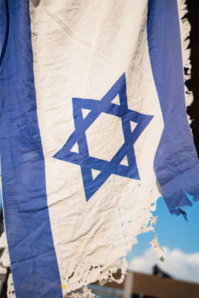 October 7, 2026, Tel Aviv, Tel Aviv, Israel: A tattered Israeli flag is held up in protest against the Israeli government on the third anniversary of October 7th. Tel Aviv Israel  - ZUMAg280 20261007_znp_g280_002 Copyright: xYoavxGinsburgx