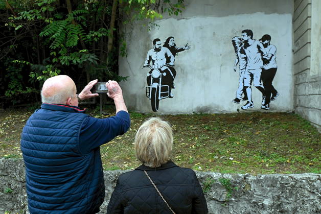 IPA89393690 - MILAN - October 7, 2026 - A mural by Alexandro Palombo, an artwork on display on October 7 at the Museum of Modern Art, located at 16 Via Palestro, dedicated to the young couple kidnapped during the attack on the Nova Music Festival Copyright: xMaurizioxMaulex xMaurizioxMaulex IPA89393690