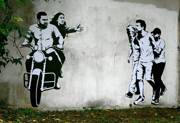 IPA89393687 - MILAN - October 7, 2026 - A mural by Alexandro Palombo, an artwork on display on October 7 at the Museum of Modern Art, located at 16 Via Palestro, dedicated to the young couple kidnapped during the attack on the Nova Music Festival Copyright: xMaurizioxMaulex xMaurizioxMaulex IPA89393687