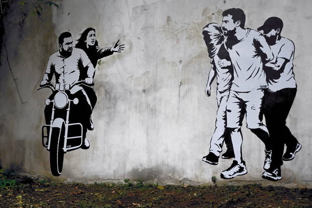 IPA89393688 - MILAN - October 7, 2026 - A mural by Alexandro Palombo, an artwork on display on October 7 at the Museum of Modern Art, located at 16 Via Palestro, dedicated to the young couple kidnapped during the attack on the Nova Music Festival Copyright: xMaurizioxMaulex xMaurizioxMaulex IPA89393688