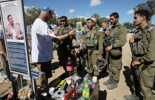 The father of Jake Marlowe, born in the UK in 1997 and immigrated to Israel in 2021, speaks to a group of Israeli combat soldiers and thanks them for their service in the Re im memorial on the third anniversary where Hamas massacred 364 people and took another 40 hostage during the Nova dance party on October 7, 2023, near Kibbutz Re im, southern Israel on Wednesday, October 7, 2026. The Hamas cross-border attacks resulted in the deaths of approximately 1,200 people and the abduction of 251 hostages.  ISR2026060800299 JimxHollander