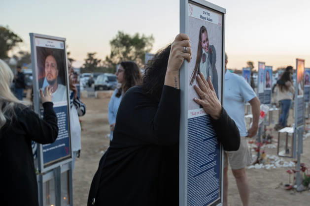 Israelis mourn at sunrise in the Re im memorial on the third anniversary where Hamas massacred 364 people and took another 40 hostages during the Nova dance party on October 7, 2023, near Kibbutz Re im, southern Israel on Wednesday, October 7, 2026. The Hamas cross-border attacks resulted in the deaths of approximately 1,200 people and the abduction of 251 hostages.  ISR202606080044 JimxHollander