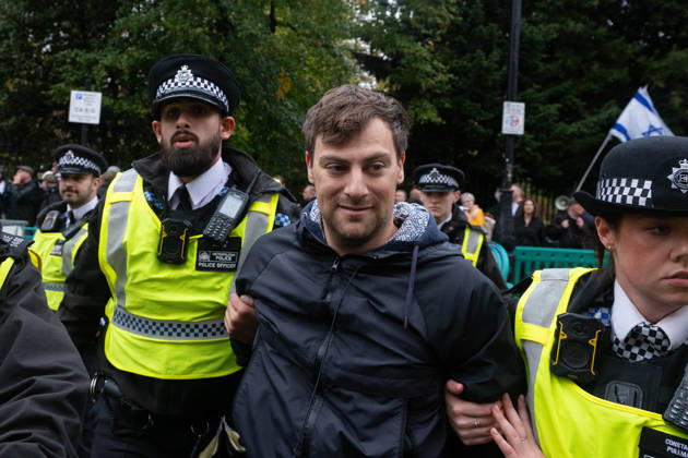 Pro-Palestinian protesters march In London LONDON, UNITED KINGDOM - OCTOBER 7: Police officers detain a Pro-Palestinian demonstrator during a protest in central London, United Kingdom, on October 7, 2026, marking the third anniversary of the October 7, 2023 attacks. Thomas Krych Anadolu London United Kingdom. Editorial use only. Please get in touch for any other usage. Copyright: x2026xAnadoluxThomasxKrychx