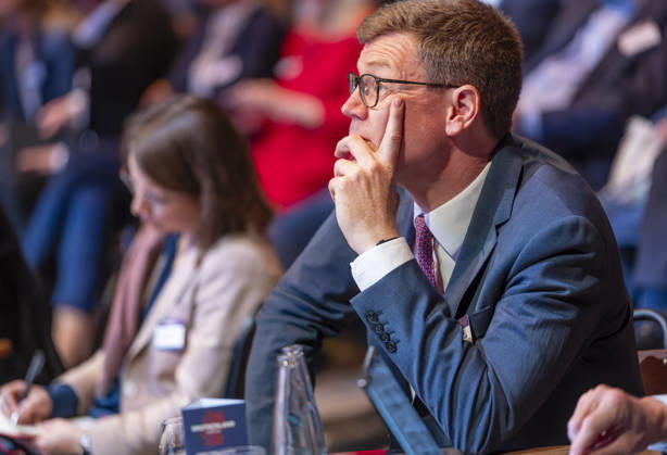Konstantin Kortmann, EUR, Germany, Berlin, October 7, 2026: Konstantin Kortmann, CEO of JLL, listens to the German Chancellor’s speech at the anniversary event in Berlin celebrating 80 years of *Handelsblatt* and 100 years of *WirtschaftsWoche*.