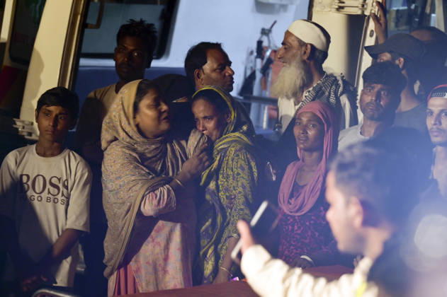 NEW DELHI, INDIA - OCTOBER 7: Mourning family members gather at the site where rescue operations are underway after a four-storey residential building collapsed in the New Seemapuri area of Shahdara on October 7, 2026, in New Delhi, India. The structural collapse occurred around 3:30 PM behind the local fish market, trapping multiple residents under concrete slabs and damaging two adjoining houses. At least one minor died while eight people were rescued and rushed to Rajiv Gandhi Super Speciality Hospital for emergency medical treatment as sniffer dogs and excavators worked late into the evening to locate remaining trapped survivors. (Photo by Raj K Raj Hindustan Times) 3 Dead, Eight Injured In 5 Storey Building Collapses In New Seemapuri O
