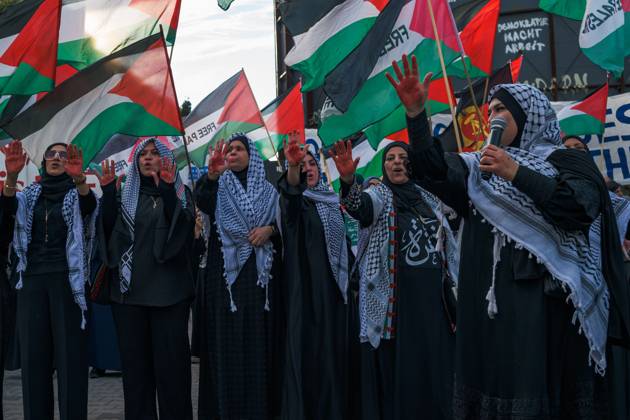 October 7, 2026, Berlin, Berlin, Germany: BERLIN, GERMANY, OCTOBER 7, 2026: Demonstrators gather at Checkpoint Charlie in central Berlin to mark three years since the start of the Gaza war. Participants protest against Israelâ€⠢s military actions in Gaza, which they describe as genocide, and express solidarity with Palestinians. Berlin Germany - ZUMAq101 20261007_zna_q101_404 Copyright: xNikosxKanistrasx