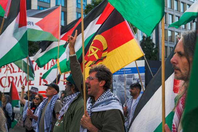 October 7, 2026, Berlin, Berlin, Germany: BERLIN, GERMANY, OCTOBER 7, 2026: Demonstrators gather at Checkpoint Charlie in central Berlin to mark three years since the start of the Gaza war. Participants protest against Israelâ€⠢s military actions in Gaza, which they describe as genocide, and express solidarity with Palestinians. Berlin Germany - ZUMAq101 20261007_zna_q101_415 Copyright: xNikosxKanistrasx