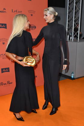 ABOUT YOU Opera Fashion Show: Caro Daur and Lena Gercke at the ABOUT YOU Opera Fashion Show in Berlin on October 7, 2026 Copyright: xEventpressxBerndtx