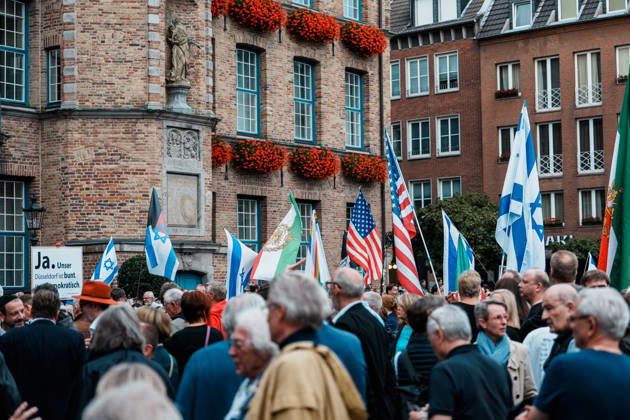 Rally in Düsseldorf marking the anniversary of Hamas’s terrorist attack on Israel on October 7, 2023, and protesting anti-Semitism; flags in front of City Hall, including a historic U.S. flag, as well as flags of Iran and Israel Copyright: xThiemoxRudolphx