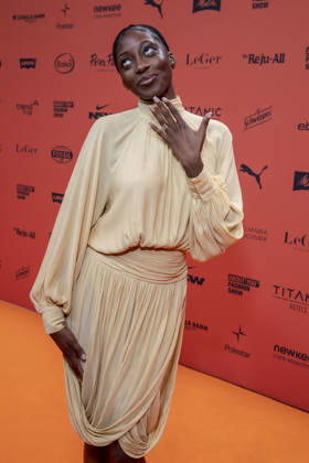 ABB ABOUTYOU Toni Dreher Adenuga as a guest on the Orange Carpet at the ABOUT YOU Opera Fashion Show at the Admiralspalast on October 7, 2026, in Berlin, Germany