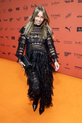 ABB ABOUTYOU Annemarie Carpendale makes a solo appearance on the Orange Carpet at the ABOUT YOU Opera Fashion Show at the Admiralspalast on October 7, 2026, in Berlin, Germany