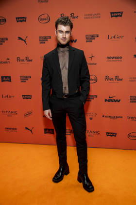 ABB ABOUTYOU s Linus Weber as a guest on the orange carpet at the ABOUT YOU Opera Fashion Show at the Admiralspalast on October 7, 2026, in Berlin, Germany