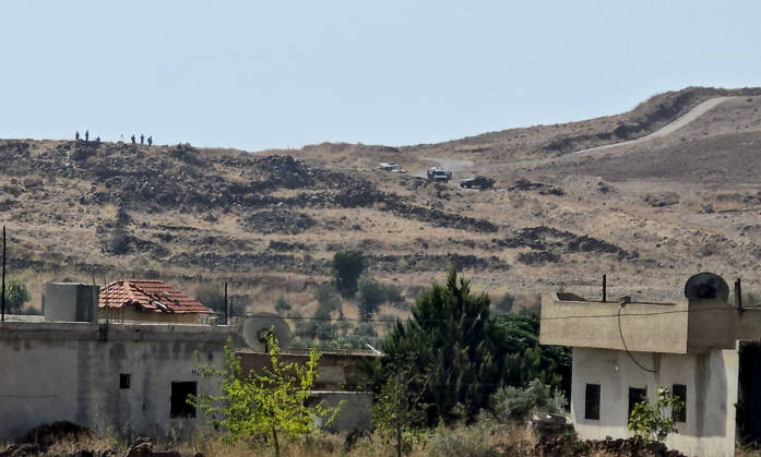 Israeli army conducts raids in Syria s Quneitra countryside QUNEITRA, SYRIA - OCTOBER 8: Israeli forces patrol the village as they conduct raids in residential areas and fire harassment shots at open areas in the countryside of Quneitra, southern Syria, on October 8, 2026. Huseyin Mesal Anadolu Quneitra Syria. Editorial use only. Please get in touch for any other usage. Copyright: x2026xAnadoluxHuseyinxMesalx
