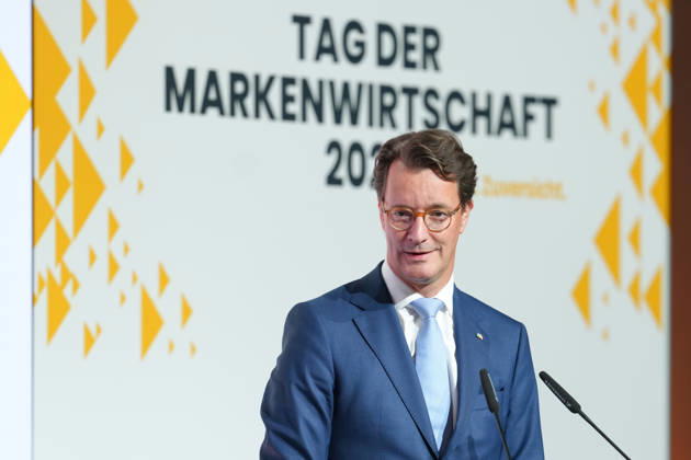 Brand Economy Day 2026 NRW: Minister President Hendrik Wuest on stage delivering his laudatory speech for Tim Hottges, winner of the Mensch Marke award, at Brand Economy Day 2026, Berlin, October 8, 2026, Berlin, Germany