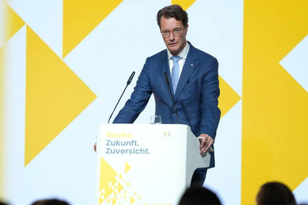 Brand Economy Day 2026 NRW: Minister President Hendrik Wuest on stage delivering his laudatory speech for Tim Hottges, winner of the Mensch Marke award, at Brand Economy Day 2026, Berlin, October 8, 2026, Berlin, Germany