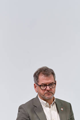 Berlin, October 8, 2026: Werner Graf of Alliance 90 The Greens looks down during a joint press statement by The Left Berlin, Alliance 90 The Greens Berlin, and the SPD Berlin following the conclusion of preliminary talks in the foyer of the Haus der Statistik. Press statement by The Left, The Greens, and the SPD in Berlin