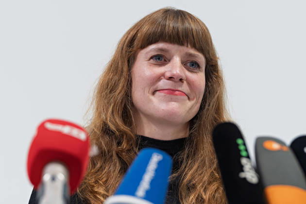 Berlin, October 8, 2026 Kerstin Wolter Ehling A member of Die Linke smiles during a joint press statement by Die Linke Berlin, Alliance 90 The Greens Berlin, and the SPD Berlin following the conclusion of preliminary talks in the foyer of the Haus der Statistik, standing behind the media microphones. Joint press statement by The Left, The Greens, and the SPD in Berlin
