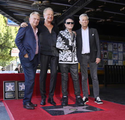 Pat Sajak, honorees Graham Russell, Russell Hitchcock and David Foster (L-R) pose during an unveiling ceremony honoring the rock duo Air Supply with the 2,859th star on the Hollywood Walk of Fame in Los Angeles on Thursday October 8, 2026. LAP2026100807 JIMxRUYMEN