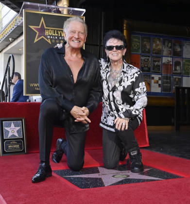 Graham Russell (L) and Russell Hitchcock of the rock duo Air Supply kneel next to their star during an unveiling ceremony honoring them with the 2,859th star on the Hollywood Walk of Fame in Los Angeles on Thursday October 8, 2026. LAP2026100809 JIMxRUYMEN
