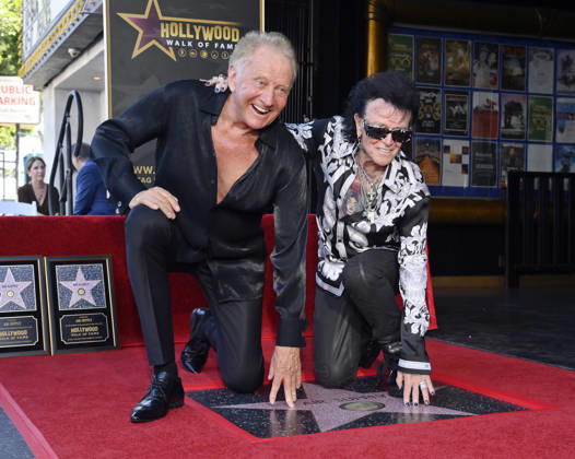 Graham Russell (L) and Russell Hitchcock of the rock duo Air Supply kneel next to their star during an unveiling ceremony honoring them with the 2,859th star on the Hollywood Walk of Fame in Los Angeles on Thursday October 8, 2026. LAP2026100810 JIMxRUYMEN