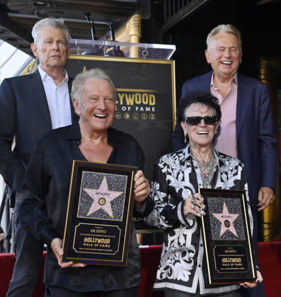 Graham Russel (L) and Russell Hitchcock of the rock duo Air Supply hold replica plaques during during an unveiling ceremony honoring them with the 2,859th star on the Hollywood Walk of Fame in Los Angeles on Thursday October 8, 2026. Looking on is David Foster (L) and Pat Sajak LAP2026100804 JIMxRUYMEN