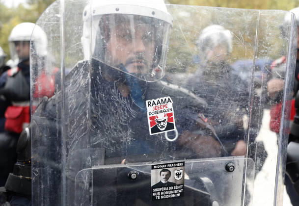 Demonstration Against the Proposed Territorial Reform in Tirana, Albania. A riot police officer stands behind a protective visor with a sticker reading Rama, give your resignation during an anti-government protest against the government s administrative and territorial reform, in front of the Parliament building in Tirana, Albania, on October 8, 2026. Light Studio Agency Malton Dibra Tirana Albania Copyright: xLightxStudioxAgencyx xMaltonxDibrax