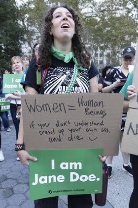 October 8, 2026, New York, New York, USA: A demonstrator holds signs that read Women equal Human Beings if you don t understand crawl up your own ass. and die I am Jane Doe. joining hundreds at a rally in Foley Square outside the New York State Supreme Court building in Lower Manhattan under the banner . StopSexualViolence: From the Frat House to the White House. The protest is one of many rallies and campus walkouts around the country demanding justice for Cornell s Jane Doe. New York USA - ZUMAr174 20261008_znp_r174_023 Copyright: xGinaxMxRandazzox