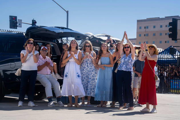 October 8, 2026, Coronado, California, United States: Family members and supporters applaud and wave as the aircraft carrier USS Abraham Lincoln (CVN 72) returns to Naval Air Station North Island in Coronado, California, on October 8, 2026, following a deployment. Some in the crowd record the homecoming on their phones as they wait near the waterfront. Coronado United States - ZUMAg374 20261008_znp_g374_004 Copyright: xLoganxGrahamx