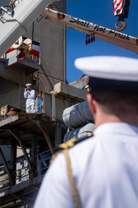 October 8, 2026, Coronado, California, United States: A U.S. Navy sailor stands on the aircraft carrier USS Abraham Lincoln (CVN 72) as the ship returns to Naval Air Station North Island in Coronado, California, on October 8, 2026, following a deployment. The words Shall Not Perish are painted on a crane above the ship s structure. Coronado United States - ZUMAg374 20261008_znp_g374_003 Copyright: xLoganxGrahamx