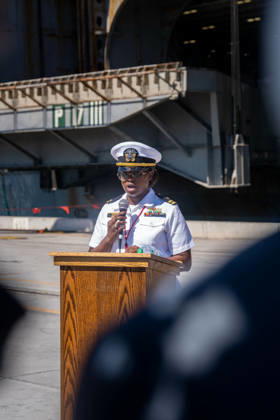 October 8, 2026, Coronado, California, United States: A U.S. Navy officer speaks into a microphone at a podium during the homecoming of the aircraft carrier USS Abraham Lincoln (CVN 72) at Naval Air Station North Island in Coronado, California, on October 8, 2026. Coronado United States - ZUMAg374 20261008_znp_g374_005 Copyright: xLoganxGrahamx