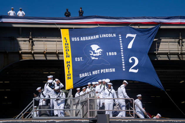 October 8, 2026, Coronado, California, United States: U.S. Navy sailors disembark from the aircraft carrier USS Abraham Lincoln (CVN 72) during its homecoming at Naval Air Station North Island in Coronado, California, on October 8, 2026, following a deployment. A banner bearing the ship s name and the words Shall Not Perish hangs above the gangway. Coronado United States - ZUMAg374 20261008_znp_g374_015 Copyright: xLoganxGrahamx