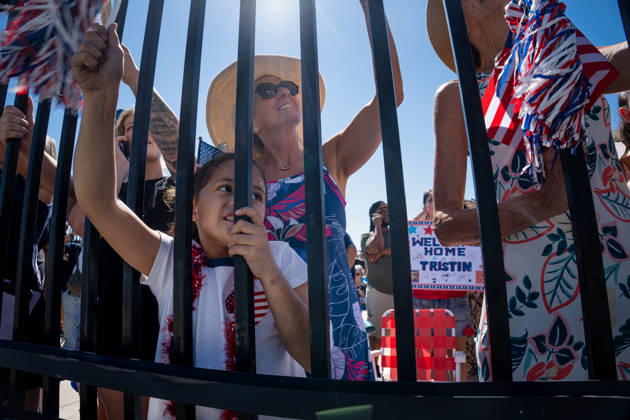 October 8, 2026, Coronado, California, United States: Family members and supporters cheer behind a fence as the aircraft carrier USS Abraham Lincoln (CVN 72) returns to Naval Air Station North Island in Coronado, California, on October 8, 2026, following a deployment. A child watches the arriving ship alongside adults waving patriotic decorations, while a sign in the background reads Welcome Home Tristin. Coronado United States - ZUMAg374 20261008_znp_g374_016 Copyright: xLoganxGrahamx
