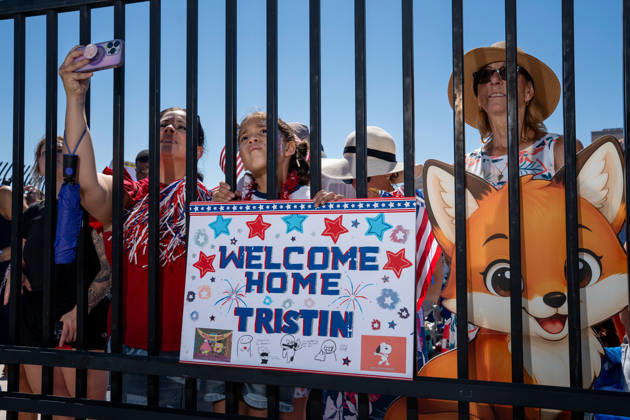 October 8, 2026, Coronado, California, United States: Family members hold a handmade welcome-home sign for sailor Tristin and pose with a character cutout as they await the return of the aircraft carrier USS Abraham Lincoln (CVN 72) at Naval Air Station North Island in Coronado, California, on October 8, 2026, following a deployment. Coronado United States - ZUMAg374 20261008_znp_g374_017 Copyright: xLoganxGrahamx