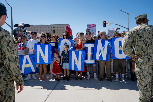 October 8, 2026, Coronado, California, United States: Family members and supporters hold large blue signs spelling out a sailor s name as they await the return of the aircraft carrier USS Abraham Lincoln (CVN 72) to Naval Air Station North Island in Coronado, California, on October 8, 2026, following a deployment. U.S. Navy personnel stand beside the crowd. Coronado United States - ZUMAg374 20261008_znp_g374_018 Copyright: xLoganxGrahamx
