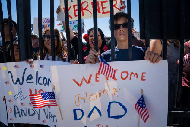 October 8, 2026, Coronado, California, United States: Family members hold handmade welcome-home signs behind a fence as the aircraft carrier USS Abraham Lincoln (CVN 72) returns to Naval Air Station North Island in Coronado, California, on October 8, 2026, following a deployment. One sign reads Welcome Home Dad, while another welcomes sailor Andy aboard the carrier. Coronado United States - ZUMAg374 20261008_znp_g374_019 Copyright: xLoganxGrahamx