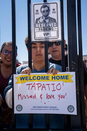 October 8, 2026, Coronado, California, United States: A family member holds a welcome-home sign for sailor Tapatio as the aircraft carrier USS Abraham Lincoln (CVN 72) returns to Naval Air Station North Island in Coronado, California, on October 8, 2026, following a deployment. The sign reads, Tapatio! Missed & love you! and bears the logos of the San Diego Navy League. Coronado United States - ZUMAg374 20261008_znp_g374_022 Copyright: xLoganxGrahamx