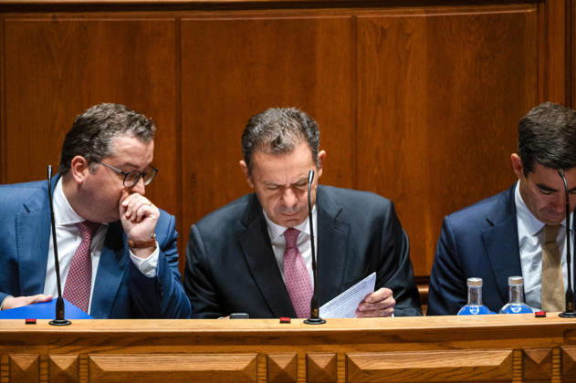 October 9, 2026, Lisbon, Lisbon, Portugal: Portuguese Prime Minister LUIS MONTENEGRO, center, reviews a document while seated on the government bench during a parliamentary session at the Assembleia da Republica in Lisbon, Portugal, on October 9, 2026. The sitting includes the fortnightly debate with the prime minister, followed by a preparatory debate for the European Council. Lisbon Portugal - ZUMAr238 20261009_zip_r238_005 Copyright: xRicardoxRochax