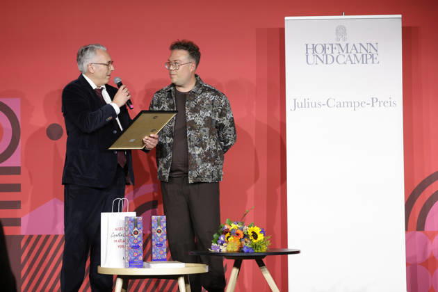 Frankfurt Impressions 09 10 2026 At the 78th Frankfurt Book Fair in 2026, the Julius Campe Prize—99 bottles of wine—will be awarded to Thomas Sachsenmeier (wearing a brown shirt, on the left). Tim Jung, publishing director at Hoffmann und Campe, Frankfurt am Main, Hesse, Germany